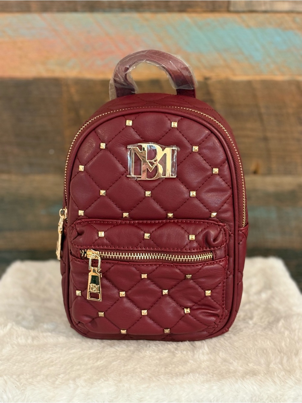 Badgley Mischka Quilted Burgundy Mini Backpack with Gold Hardware